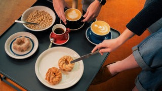 Acme Classic Espresso Range on table with plates and cups and saucers