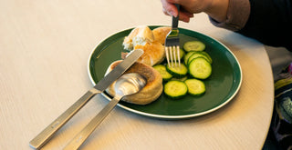 Acme plate using Acme Cutlery for a bagel and cucumbers